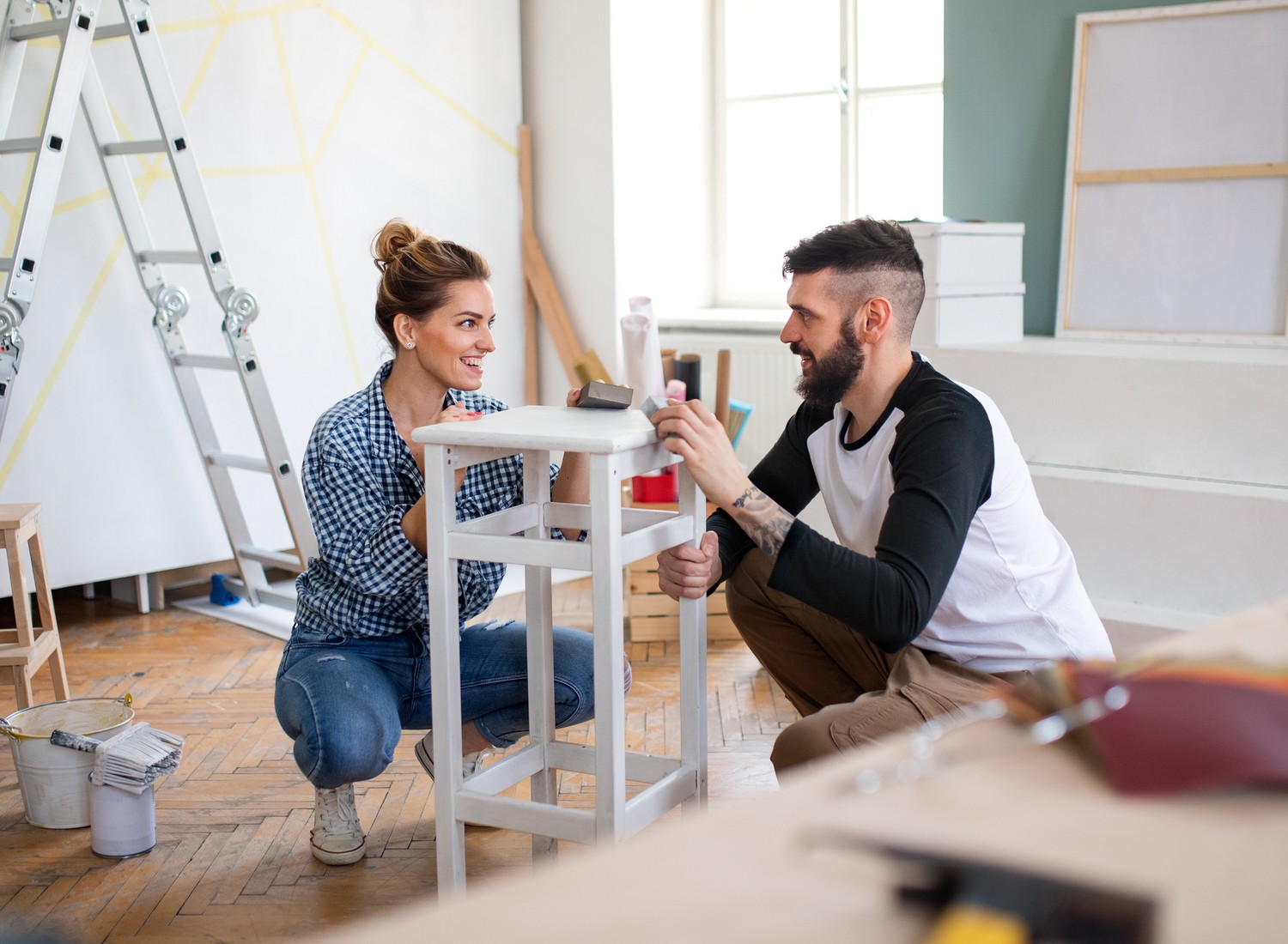 diy-home-projects independence Happy mid adults couple renovating furniture indoors at home