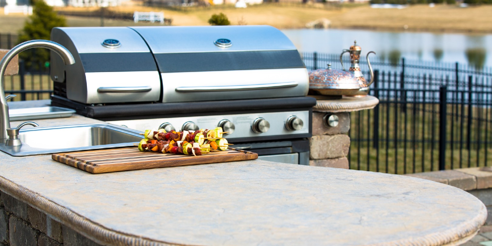 outdoor-kitchen-countertops the-independence Freshly prepeared skewers are waiting on outside kitchen counter top to be grilled.