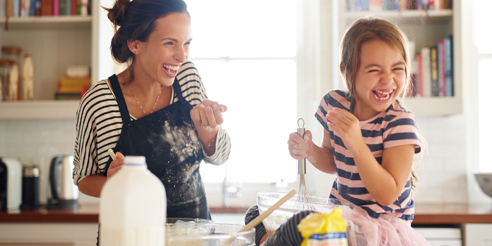 kid-friendly-recipes the-independence Shot of a little girl having fun baking with her mother in the kitchen