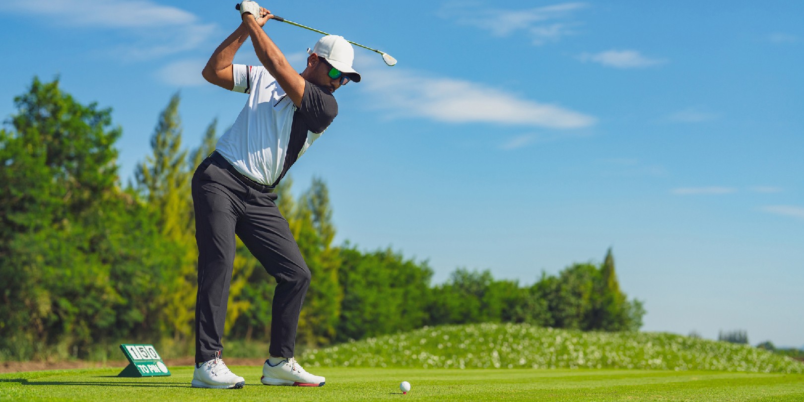golf-terms-beginners-should-know the-independence Asian man golfing on the course in summer