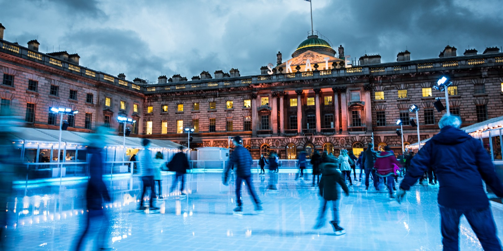 ice-skating-in-london the-independence Blurred motion of crowds of people ice skating at Somerset House, a publically owned building in central London